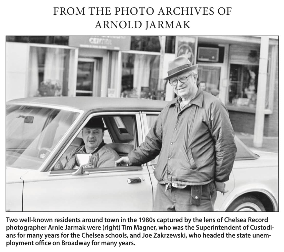 Retrospective archive panel with an Arnie Jarmak photograph of Tim Magner and Joe Zakrzewski beside a car in Chelsea.
